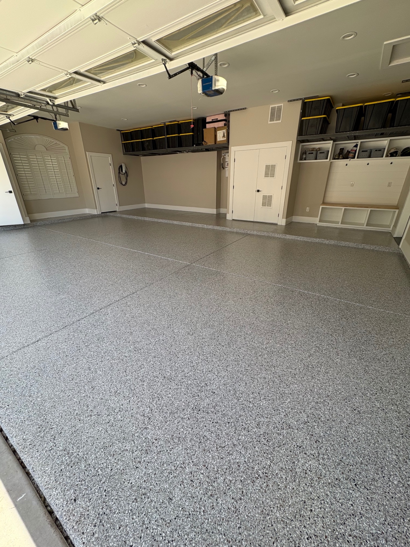 Freshly coated residential garage floor with decorative flake