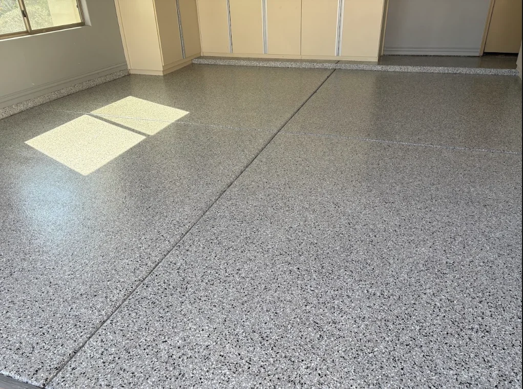 Professionally coated garage floor with durable concrete coating by The Garage Monkey
